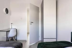 Posteľ alebo postele v izbe v ubytovaní Quadratum Apartment by Noclegi Renters