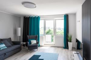 Posedenie v ubytovaní Quadratum Apartment by Noclegi Renters