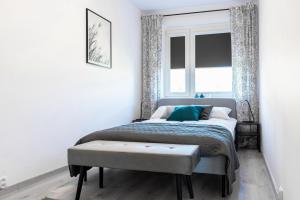 Posteľ alebo postele v izbe v ubytovaní Quadratum Apartment by Noclegi Renters