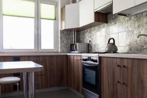 Kuchyňa alebo kuchynka v ubytovaní Quadratum Apartment by Noclegi Renters