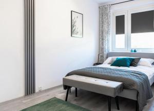 Posteľ alebo postele v izbe v ubytovaní Quadratum Apartment by Noclegi Renters