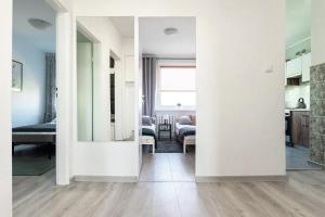 Posteľ alebo postele v izbe v ubytovaní Quadratum Apartment by Noclegi Renters