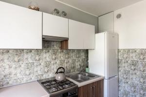 Kuchyňa alebo kuchynka v ubytovaní Quadratum Apartment by Noclegi Renters