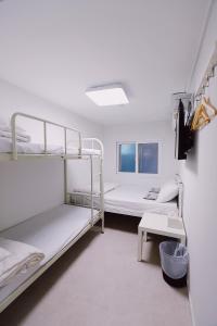 Postel nebo postele na pokoji v ubytování Fully Mini Hotel