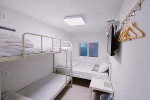 Postel nebo postele na pokoji v ubytování Fully Mini Hotel