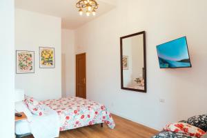 A bed or beds in a room at Relais CuoreNapoletano