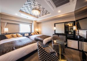 Cama ou camas em um quarto em APA Hotel Hakataeki Chikushiguchi