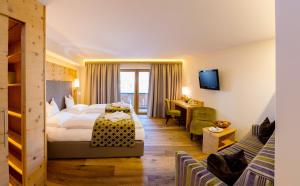 Postel nebo postele na pokoji v ubytování Hotel Post