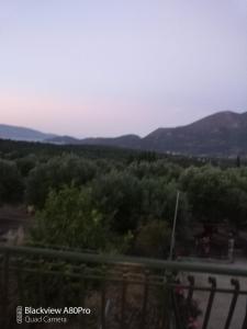 a view of the mountains from the balcony of a house at CHRYSPY Toulatos Studios in Pouláta