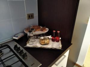 a small kitchen with a stove and a plate of food at Appartamento Nausicaa in Lamezia Terme