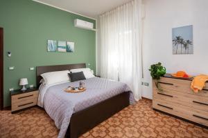 Posteľ alebo postele v izbe v ubytovaní Appartamenti Villa Miramare
