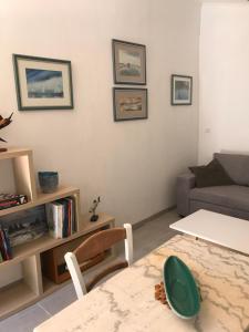 a living room with a couch and a table at Domaine Trevinella in Cauro