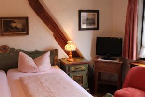 Postel nebo postele na pokoji v ubytování Hotel Spitzweg