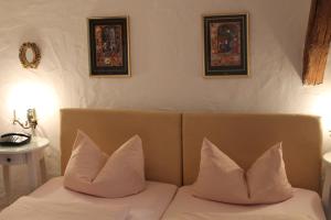 Postel nebo postele na pokoji v ubytování Hotel Spitzweg