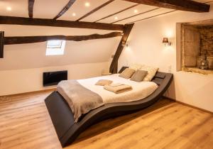 a bedroom with a large bed in a room at Chouet'appart in Dijon