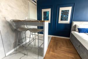 Posteľ alebo postele v izbe v ubytovaní Stylowe Apartamenty Plewiska