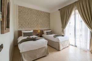 Postel nebo postele na pokoji v ubytování Marrakech Ryads Parc All inclusive