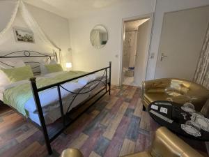 Cama ou camas em um quarto em Astoria Hotel Bad Wildstein