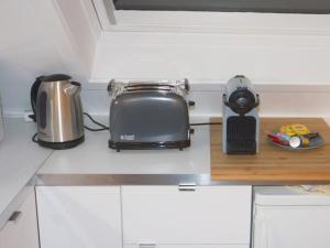 a kitchen counter with a toaster and a toaster at StudioLille - Alexandre in Lille