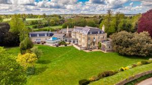 an aerial view of a large house on a lawn at Leigh Park Country House Hotel & Vineyard, BW Signature Collection in Bradford on Avon