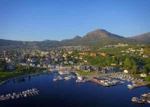 an aerial view of a harbor with boats in the water at Modern apartment in the Harbour of Jørpeland in Jørpeland