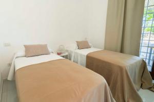 A bed or beds in a room at HelloApulia - Trulli Le Murge