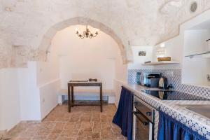 A kitchen or kitchenette at HelloApulia - Trulli Le Murge