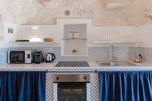 A kitchen or kitchenette at HelloApulia - Trulli Le Murge