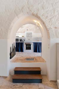 A bed or beds in a room at HelloApulia - Trulli Le Murge
