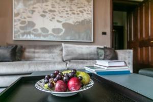 a plate of fruit on a table in a living room at Penrhiw Priory in St. Davids