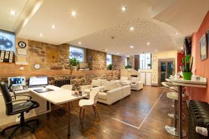 a living room with a table and chairs at Pension Aida in San Sebastián