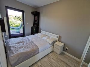 מיטה או מיטות בחדר ב-Apartament LUCKY 7 Gardenia Seaside