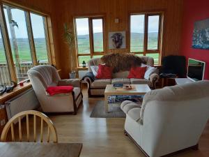 Posezení v ubytování Kópareykir Cottage