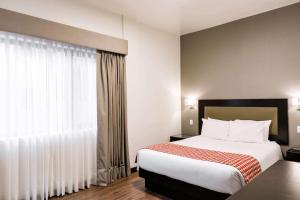 Voodi või voodid majutusasutuse Wyndham Costa del Sol Piura toas