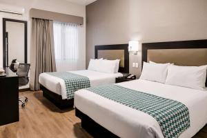 Voodi või voodid majutusasutuse Wyndham Costa del Sol Piura toas