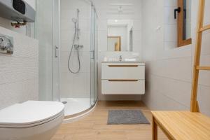 Kúpeľňa v ubytovaní Apartamenty Zielona 11 by Noclegi Renters
