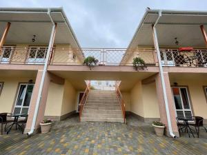 a stairway leading to a building with a balcony at ZAKAT in Zatoka