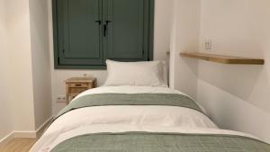 Posteľ alebo postele v izbe v ubytovaní El Gavell, Terrace Boutique Apartament