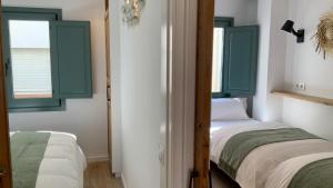 Posteľ alebo postele v izbe v ubytovaní El Gavell, Terrace Boutique Apartament
