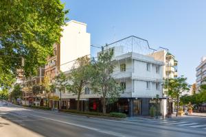 a white building with a glass dome on a street at iloftmalaga Ricardo Soriano in Marbella