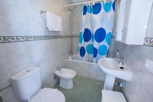 a bathroom with a toilet and a sink at Ladera Panorama 22 in Málaga