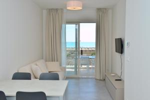 TV a/nebo společenská místnost v ubytování Ashanti Aparthotel Wellness&Spa