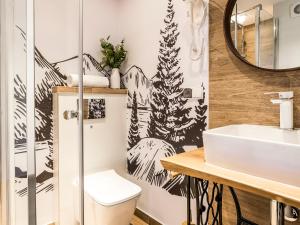 a bathroom with a toilet and a sink at Dom Gościnny WYBRANIEC in Poronin +42 photos