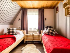 A bed or beds in a room at Dom Gościnny WYBRANIEC