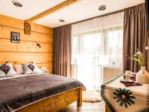 Ліжко або ліжка в номері Dom Gościnny WYBRANIEC
