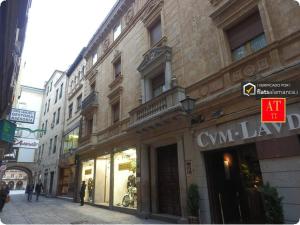 a building on the side of a city street at HomyAT Prior Romo, Plaza Mayor in Salamanca