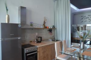 Kuchnia lub aneks kuchenny w obiekcie Zeus Throne Suites