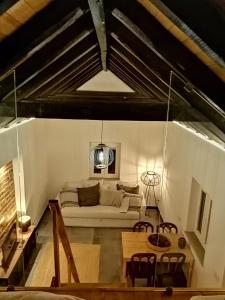 a living room with a couch and a table at Villa Vista in Sesimbra