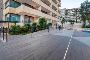 a balcony of a building with a swimming pool at Halley Hotel & Apartments Affiliated by Meliá in Benidorm
