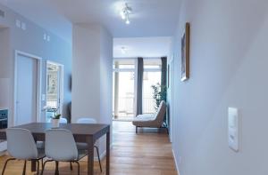 a dining room with a table and chairs at HITrental Marktplatz Apartments in Basel